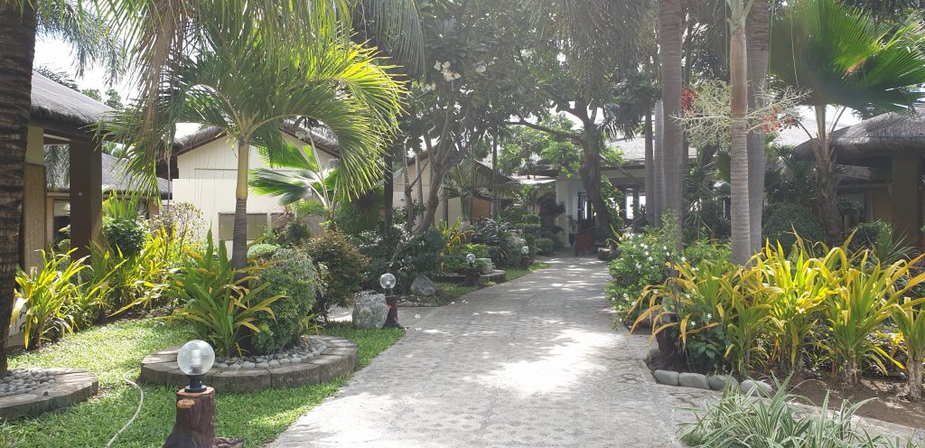 Garden walkway that takes you to your room in Kahuna Resort a beach resort in San Juan La Union Philippines