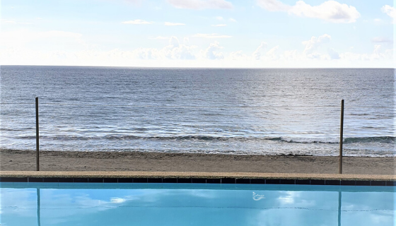 Infinity pool overlooking the beach and ocean at Kahuna Resort in San Juan La Union Philippines
